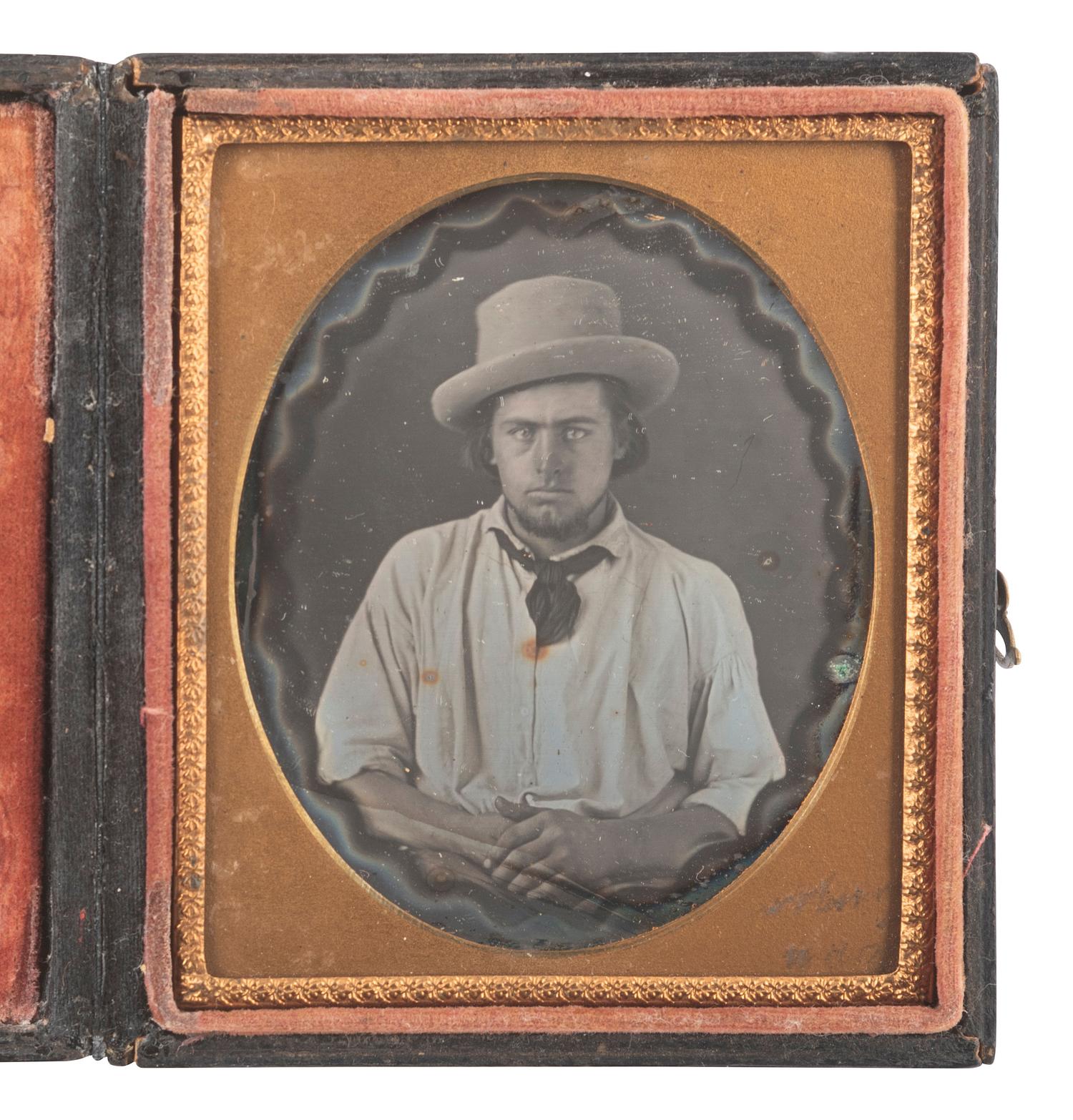 [EARLY PHOTOGRAPHY]. Sixth plate daguerreotype of a gentleman with magic background.