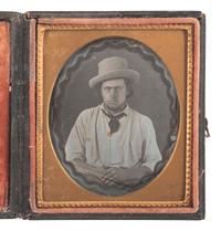 [EARLY PHOTOGRAPHY]. Sixth plate daguerreotype of a gentleman with magic background.