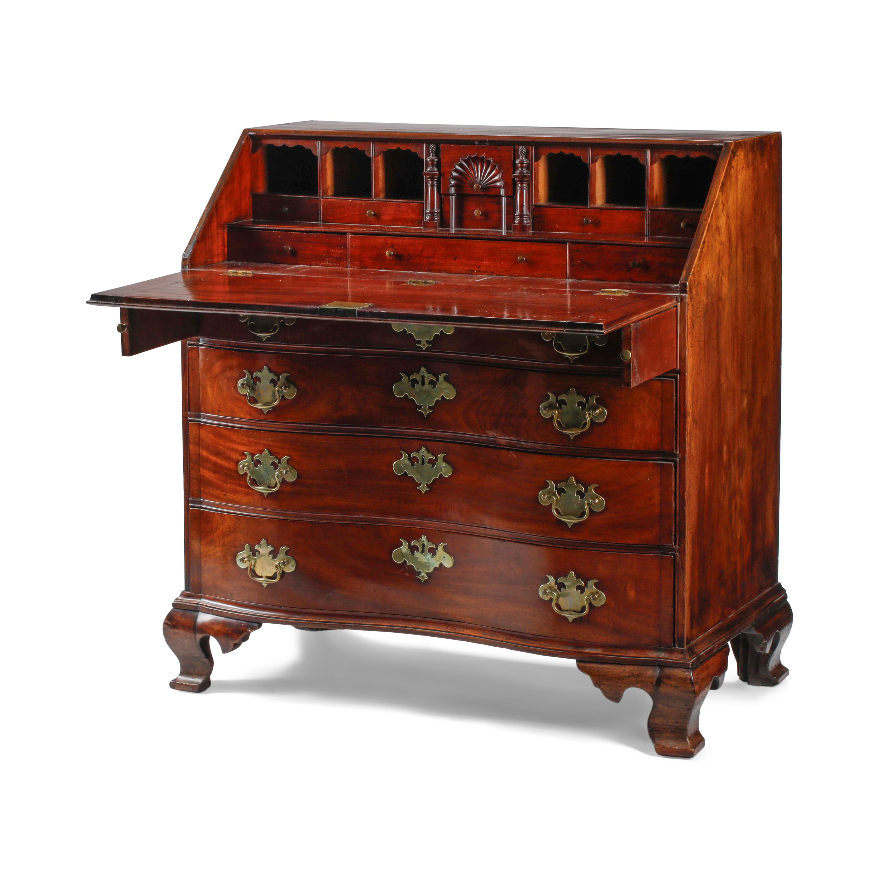 A Chippendale Figured and Fan-Carved Mahogany Serpentine Slant-Front Desk