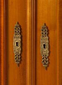 A Biedermeier Figured Walnut Two-Door Bookcase
