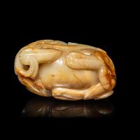 A Chinese White and Russet Jade Mythical Beast, Bixie, Ming Dynasty (1368-1644) 明 白玉辟邪