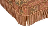 An Upholstered Button Tufted Ottoman with Skirt