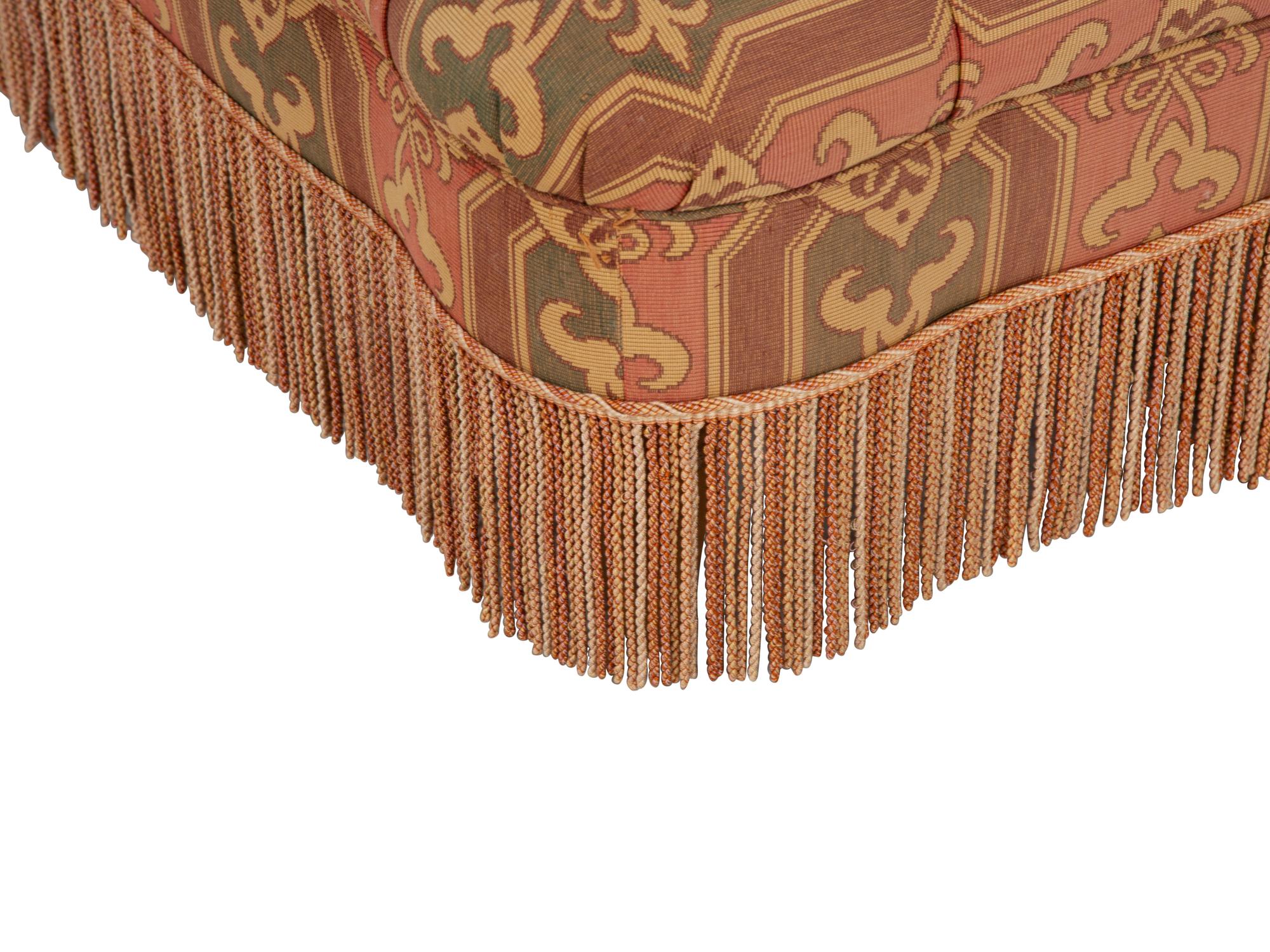 An Upholstered Button Tufted Ottoman with Skirt