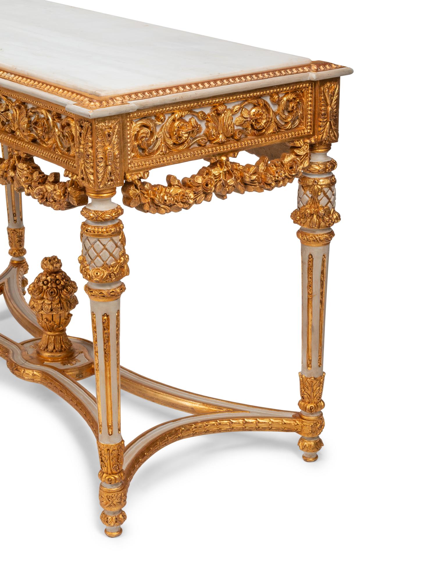 A Pair of Louis XVI Style White Painted and Parcel Gilt Marble-Top Console Tables