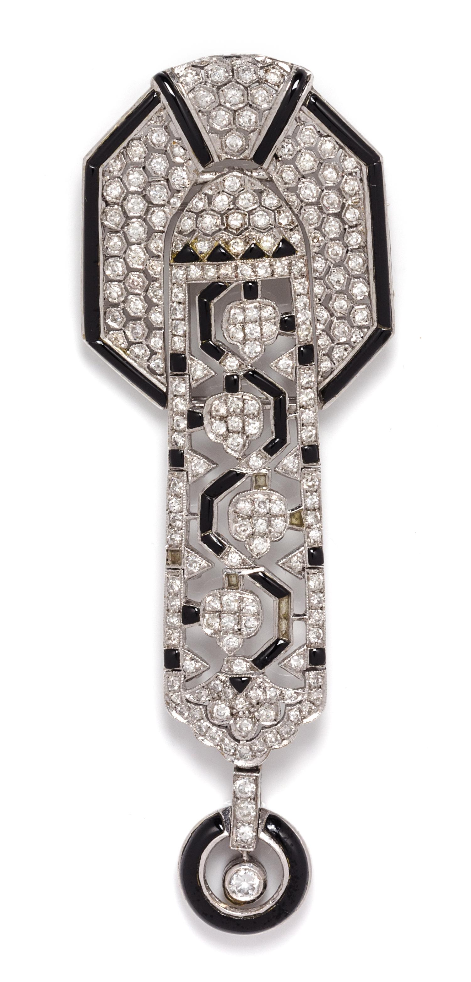 An 18 Karat White Gold, Diamond and Onyx Pendant/ Brooch, 14.70 dwts.