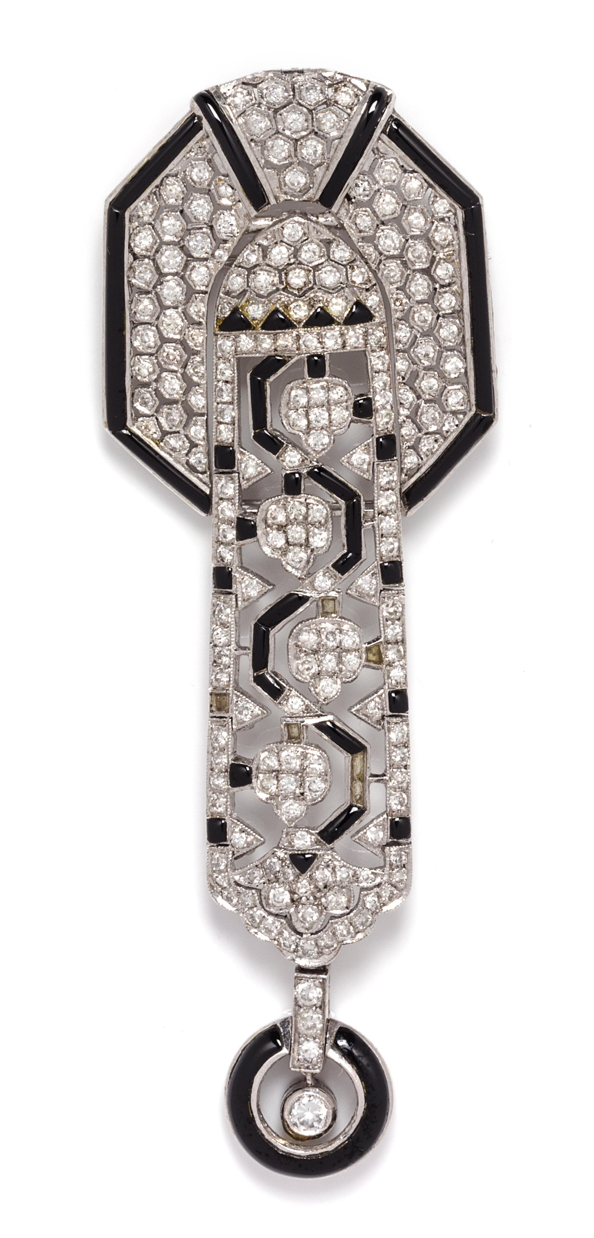 An 18 Karat White Gold, Diamond and Onyx Pendant/ Brooch, 14.70 dwts.