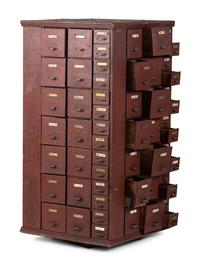A Rotating Hardware Store Storage Cabinet in Red Paint