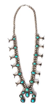 A Silver and Turquoise Squash Blossom Necklace Length 26 inches; height of naja 2 1/2 x width 2 1/2 inches.