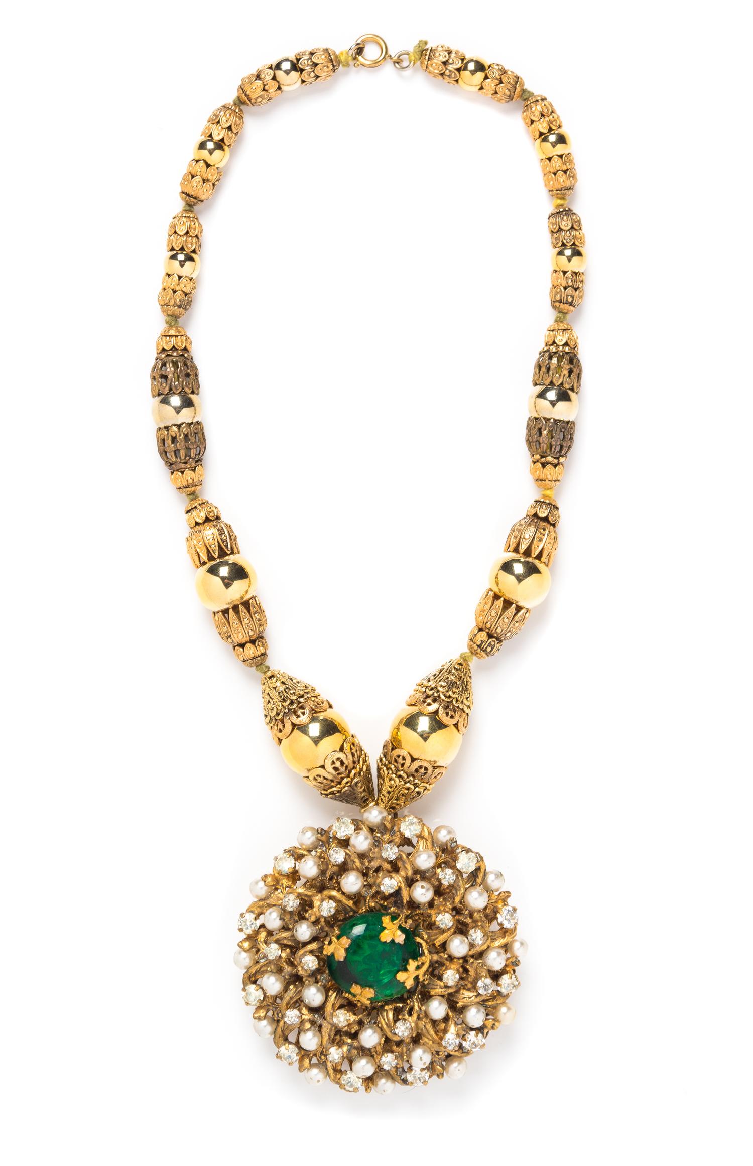 A Chanel Gold Filigree Pendant Necklace, 16" length, pendant 2.5".