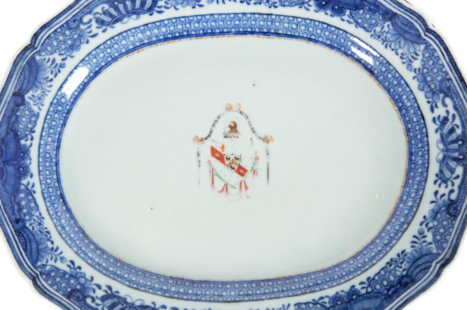A Pair of Chinese Export Porcelain Armorial Platters Raised on Later Mahogany Stands