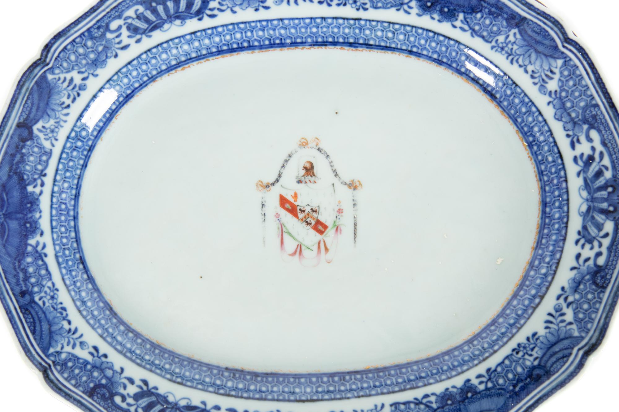 A Pair of Chinese Export Porcelain Armorial Platters Raised on Later Mahogany Stands