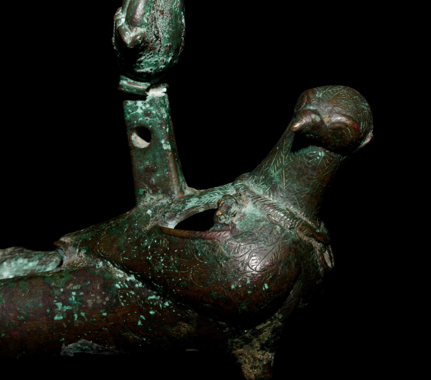 A Roman Bronze Oil Lamp in the Shape of a Dove with the Bust of a Goddess