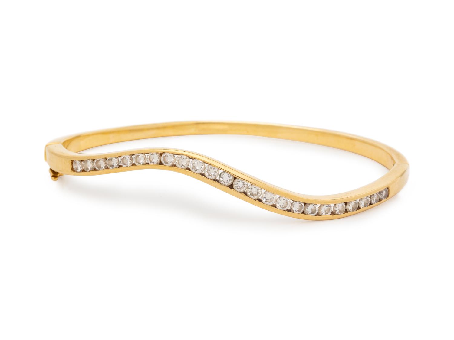 A 14 Karat Yellow Gold and Diamond Bangle Bracelet,