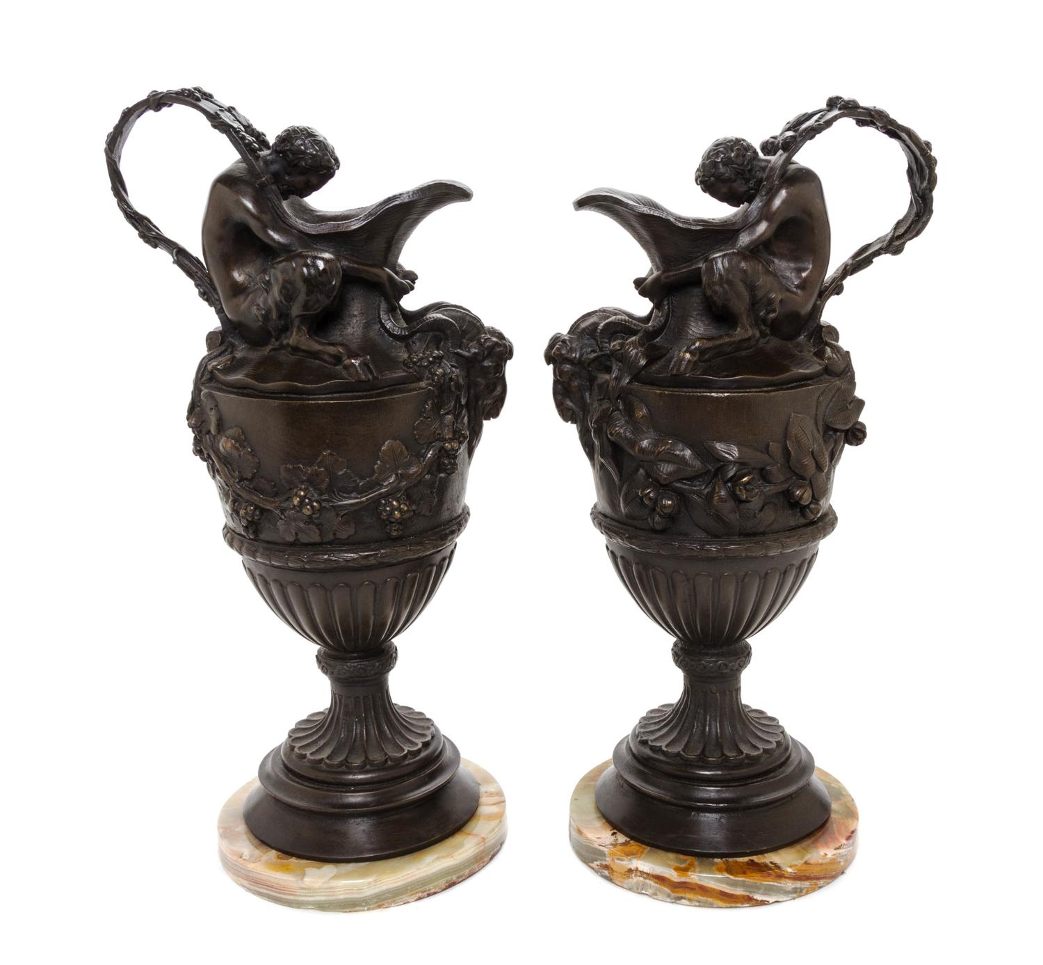 A Pair of Continental Bronze Ewers, Height 17 3/4 inches.