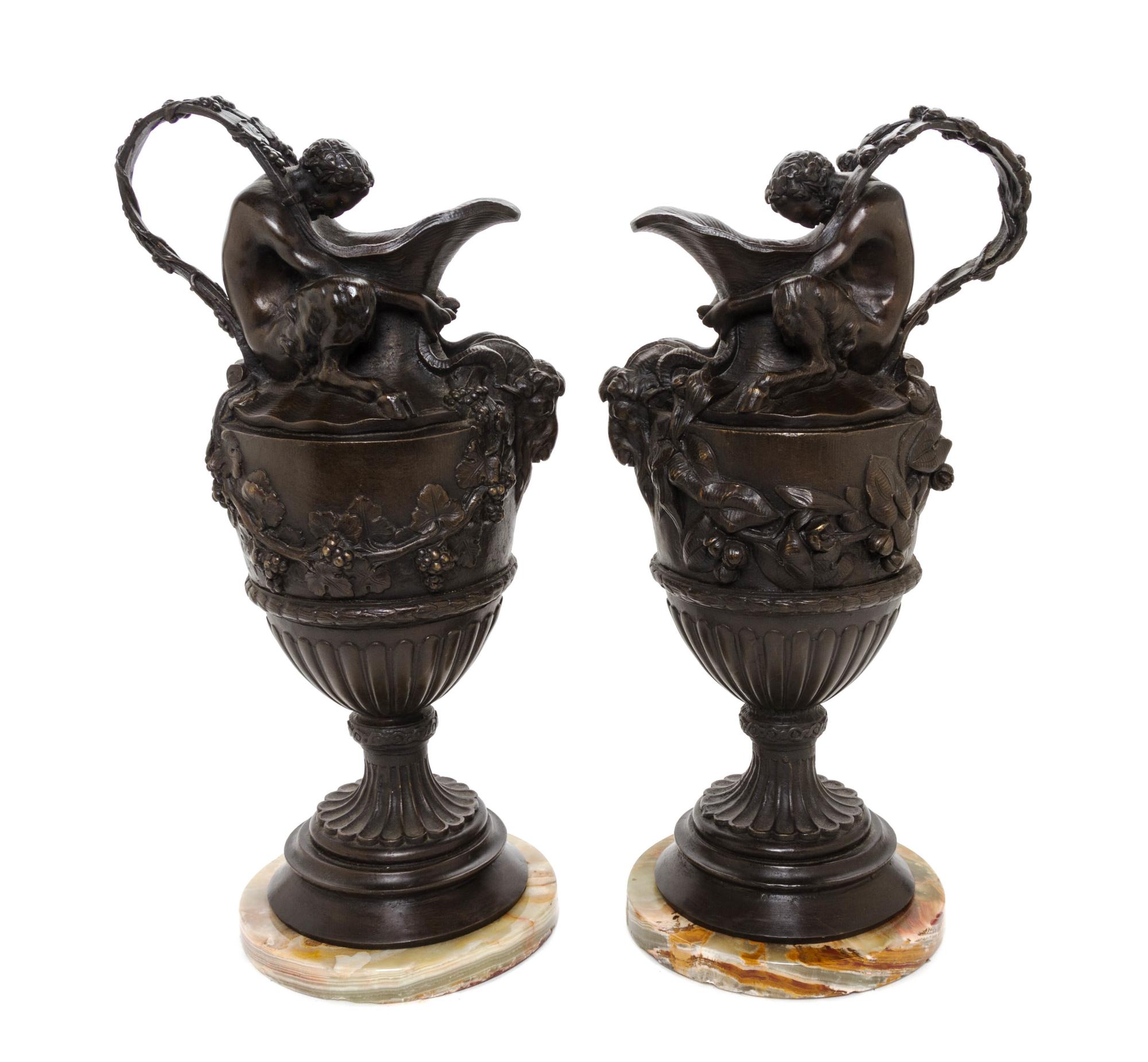 A Pair of Continental Bronze Ewers, Height 17 3/4 inches.