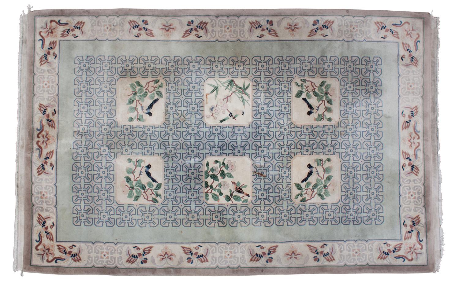 An Asian Design Wool Rug 3 feet 8 inches x 2 feet 5 1/2 inches. — 20TH CENTURY