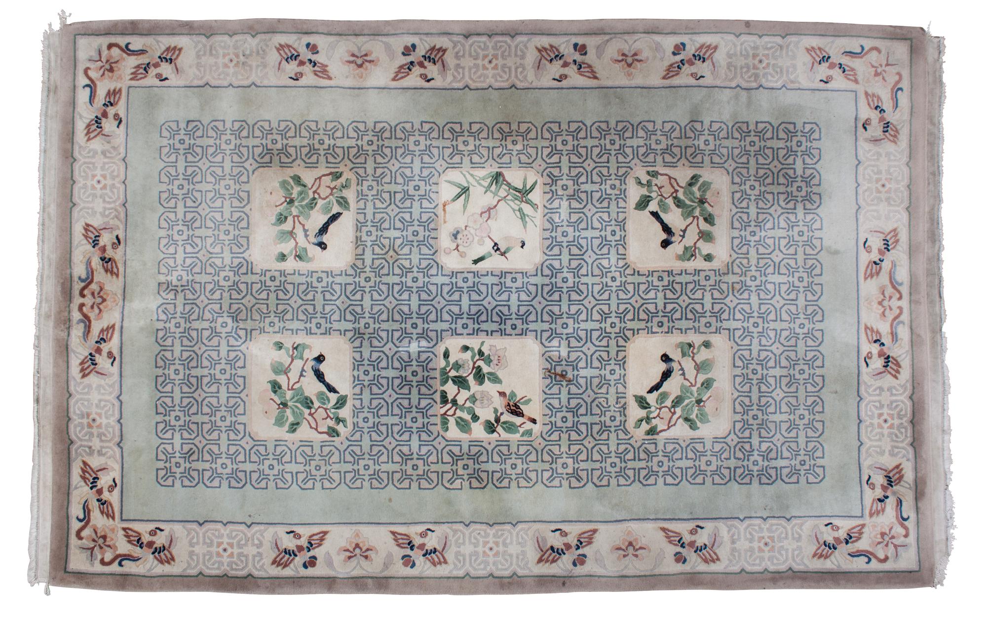 An Asian Design Wool Rug 3 feet 8 inches x 2 feet 5 1/2 inches. — 20TH CENTURY