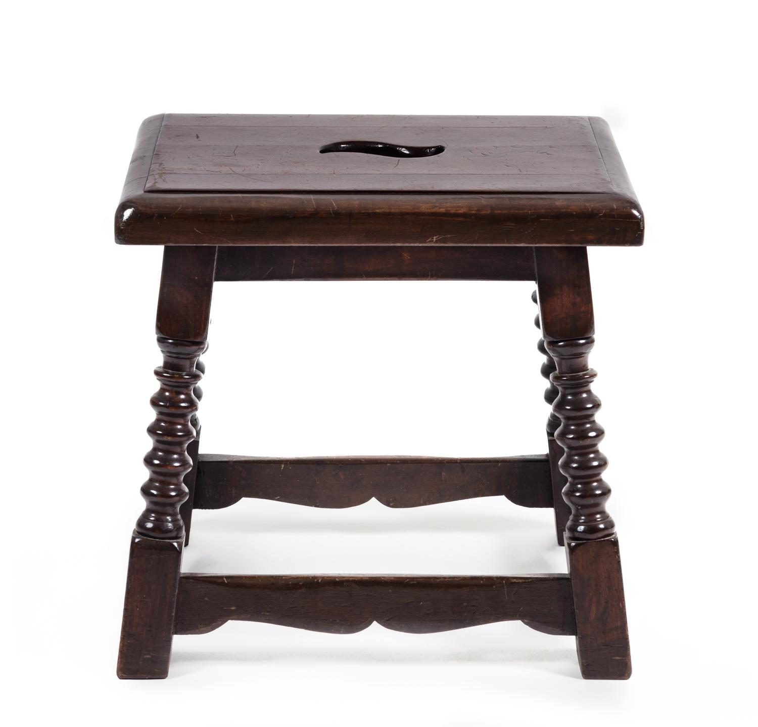 A Jacobean Style Oak Stool Height 17 x width 17 1/2 x depth 14 inches.