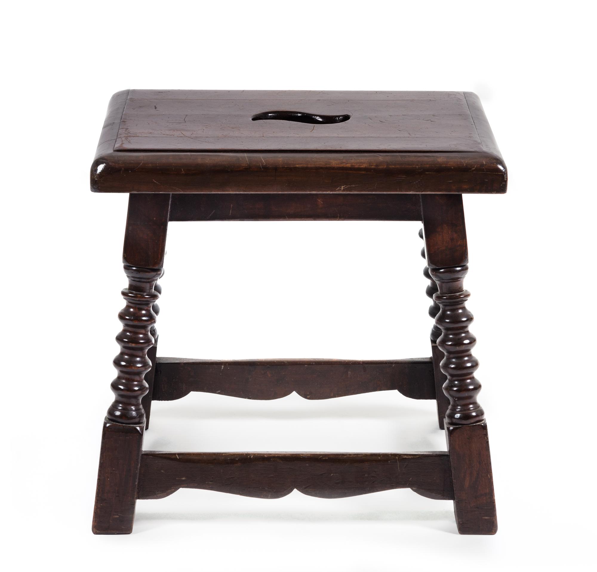 A Jacobean Style Oak Stool Height 17 x width 17 1/2 x depth 14 inches.