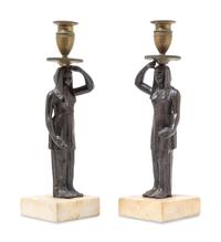 A Pair of Bronze Figural Candlesticks
