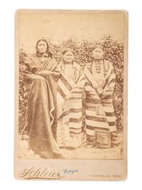 [NATIVE AMERICANS] -- [MORROW, Stanley J., photographer, after]. Period copy cabinet card of Brule Chief Spotted Tail with his wife and daughter. Nashville, TN: Schleier.