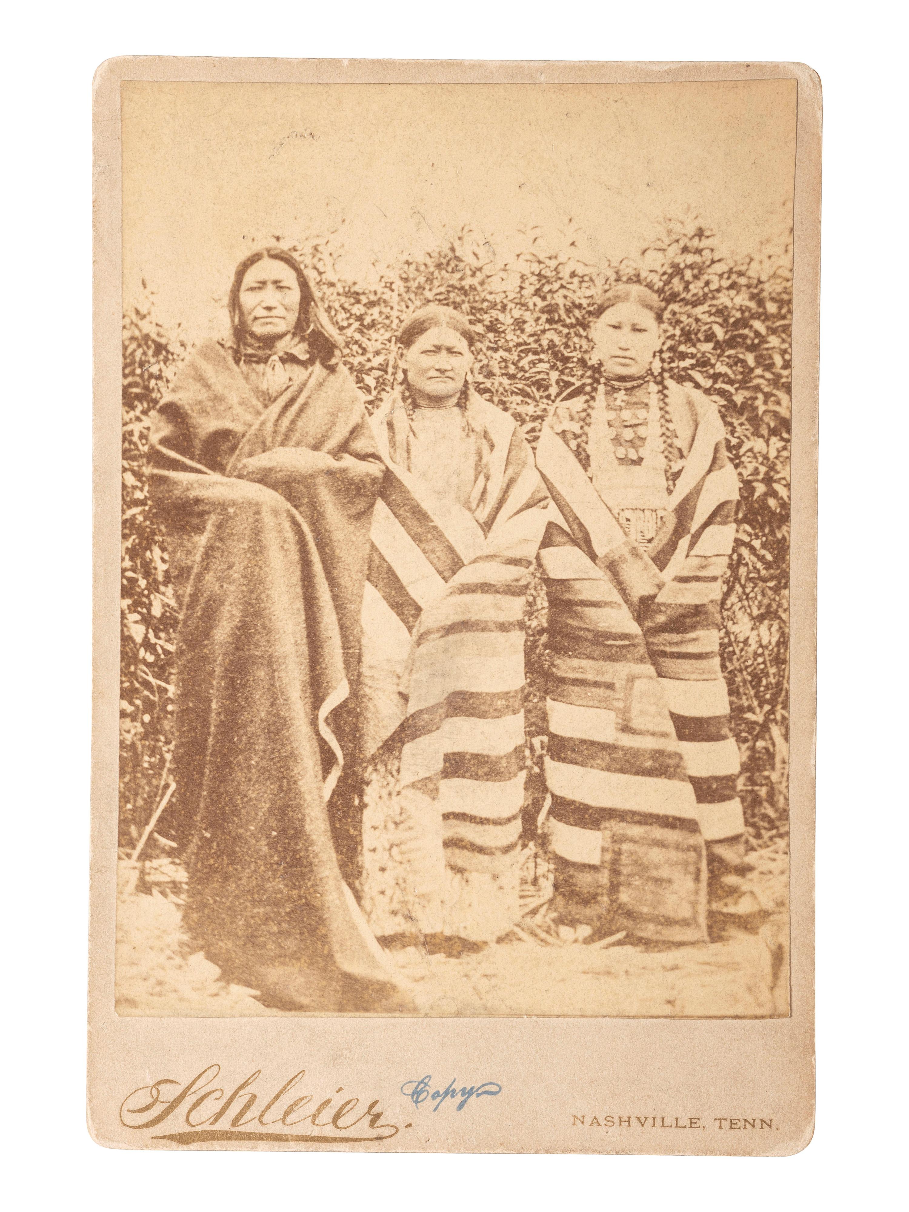 [NATIVE AMERICANS] -- [MORROW, Stanley J., photographer, after]. Period copy cabinet card of Brule Chief Spotted Tail with his wife and daughter. Nashville, TN: Schleier.