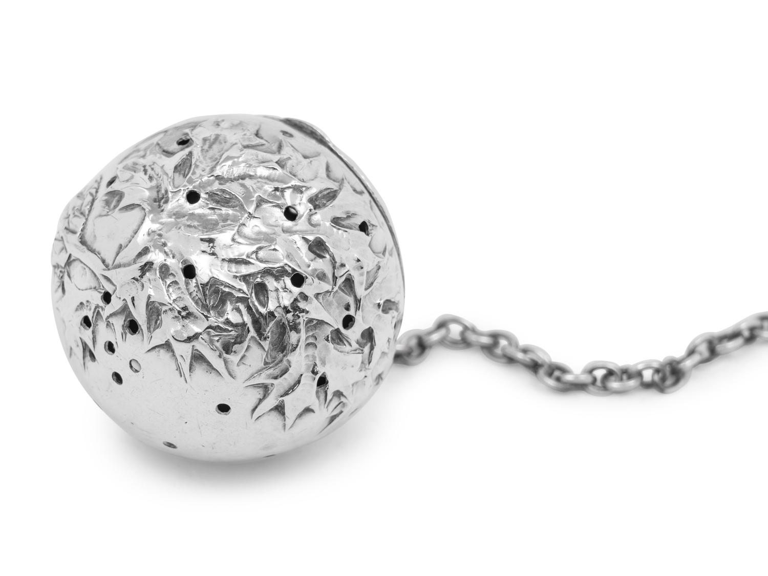 A Continental Silver Tea Caddy, Strainer and Tea Ball