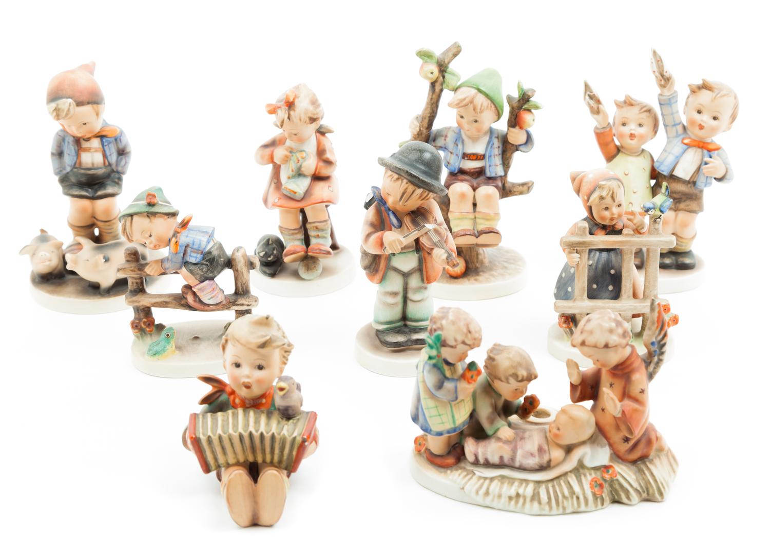A Collection of Hummel Figurines Height of tallest 6 inches.