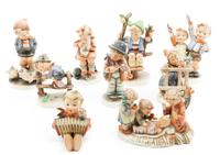 A Collection of Hummel Figurines Height of tallest 6 inches.