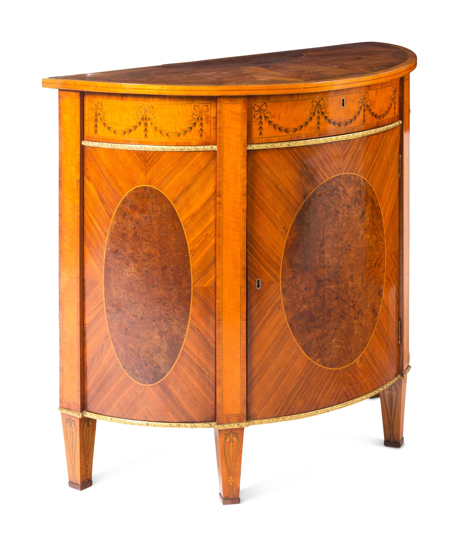 A Pair of George III Gilt Bronze Mounted Tulipwood, Burr Yew and Satinwood Marquetry Demilune Cabinets