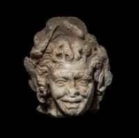 A Roman Marble Head of a Satyr