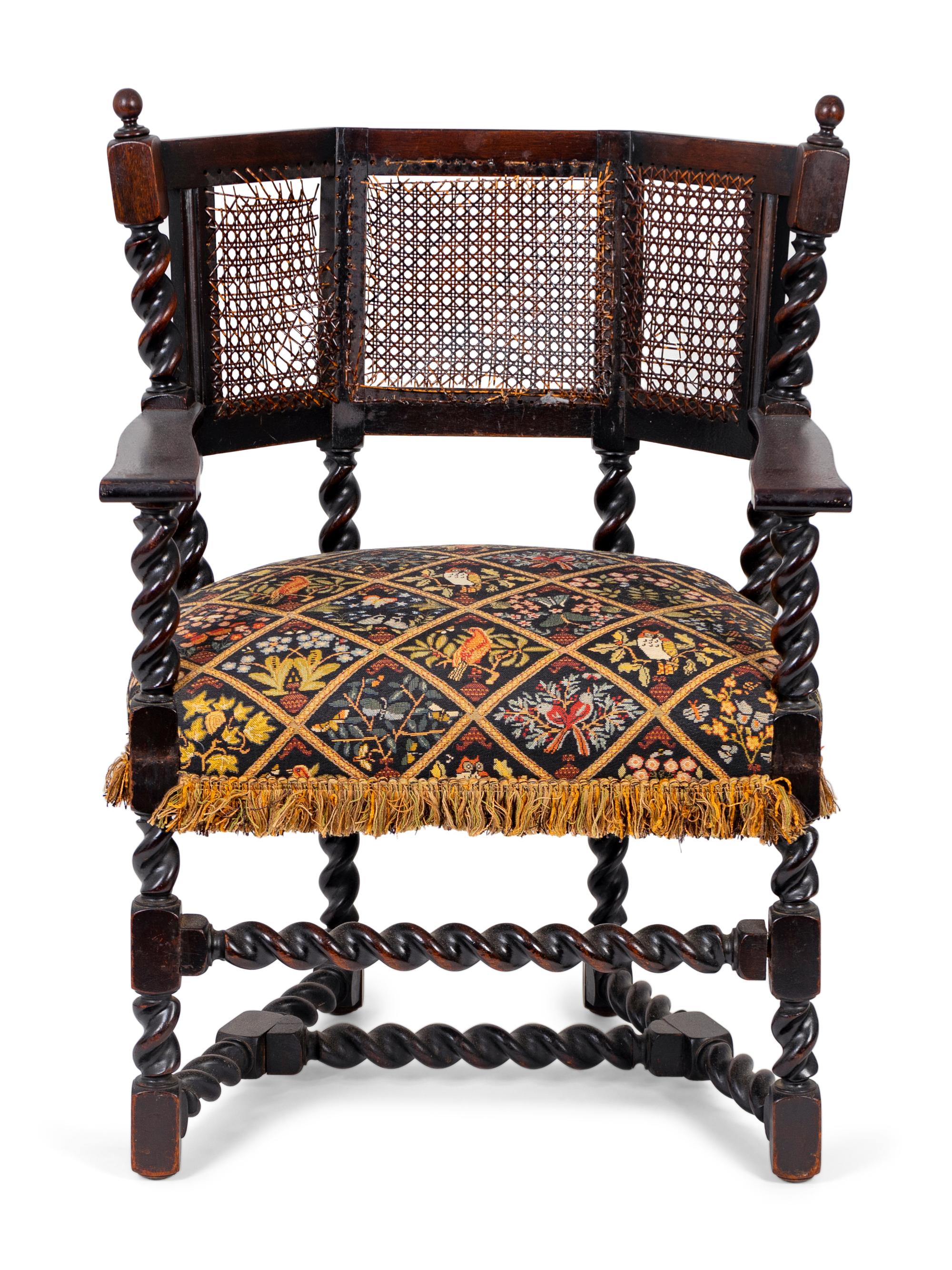 A Jacobean Style Carved Oak Cane Back Armchair — 19TH/20TH CENTURY