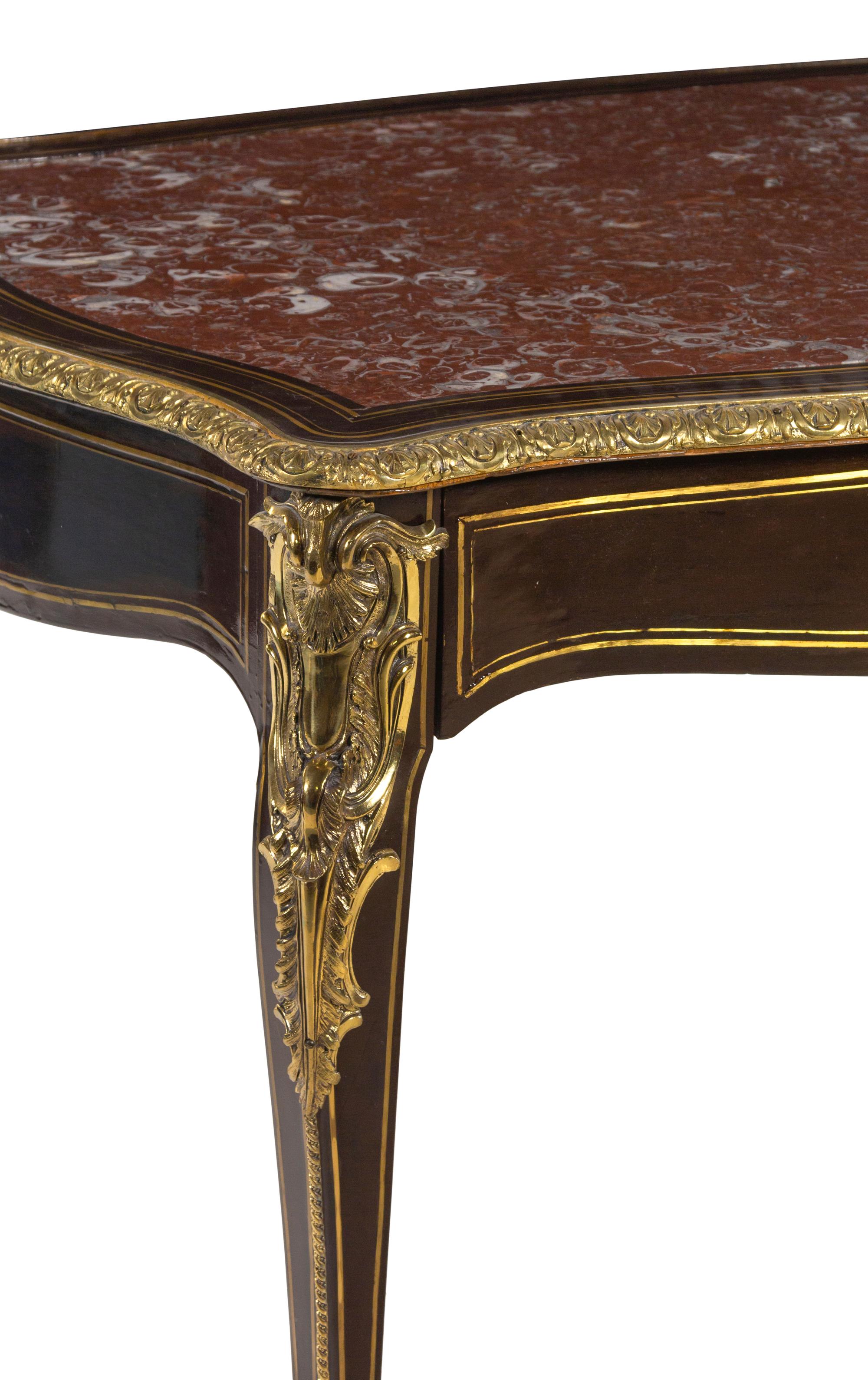 A Napoleon III Gilt Bronze Mounted Ebonized Marble-Top Center Table