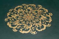 An Empire Style Gilt Bronze Mounted Mahogany Leather-Top Center Table