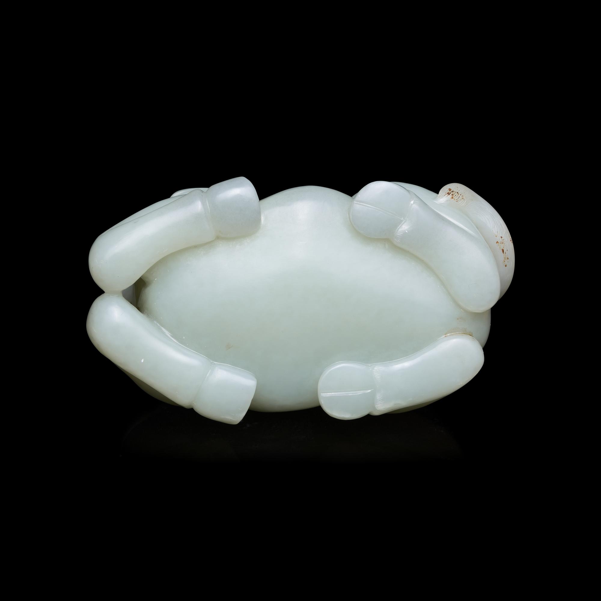 A Chinese Pale Celadon Jade Figure of a Recumbent Buffalo, Qing Dynasty 清 青玉臥牛