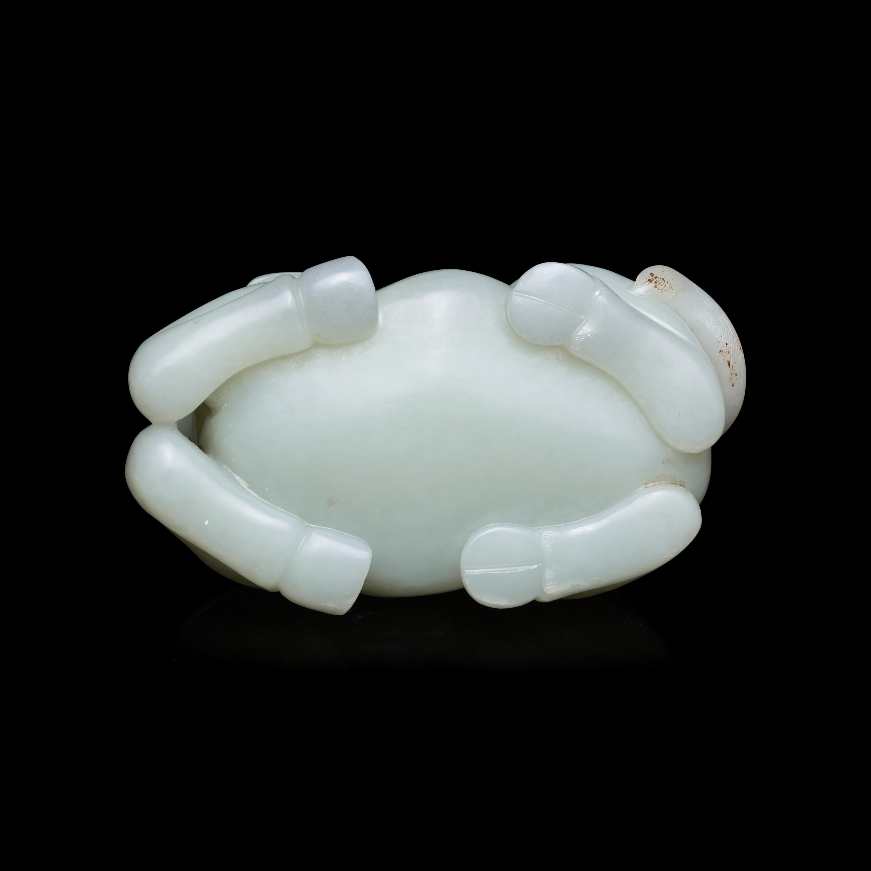 A Chinese Pale Celadon Jade Figure of a Recumbent Buffalo, Qing Dynasty 清 青玉臥牛
