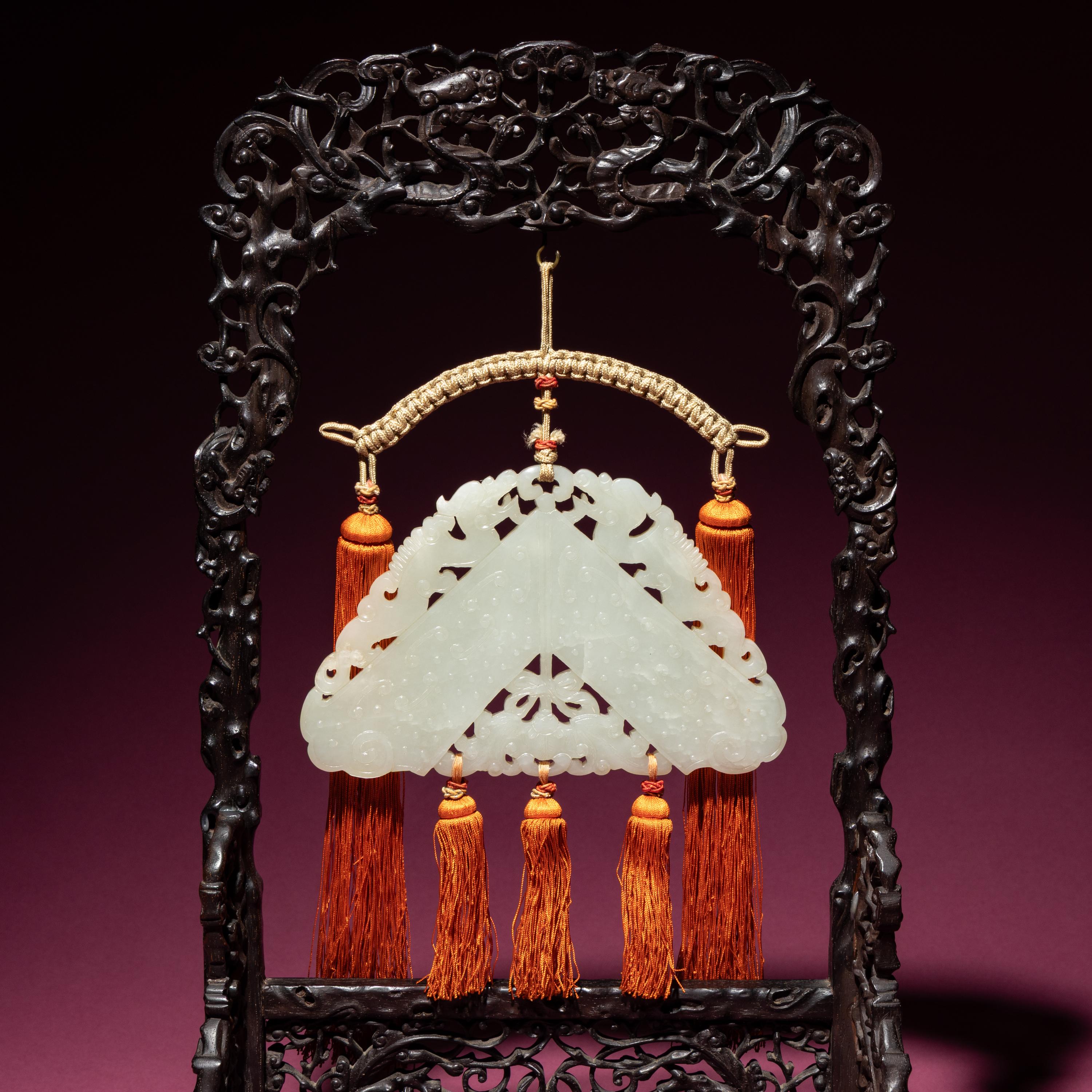 A Chinese White Jade Chime-Form Pendant, 18th/19th Century — 清中期 白玉罄