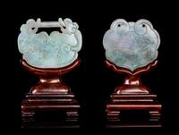 Two Chinese Jadeite Lock-Form Pendants