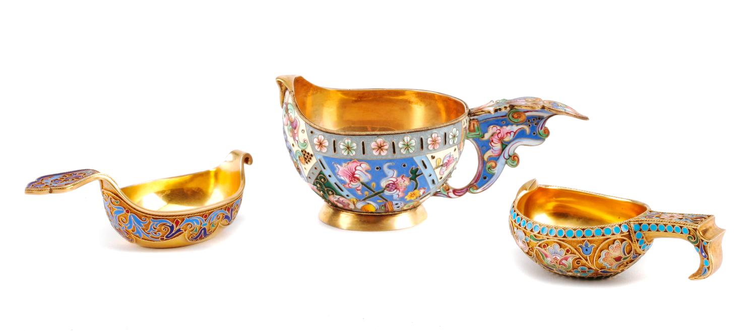 Three Russian Enameled Silver Kovshi, Various Makers, Late 19th/Early 20th Century, each having an exterior decorated with polychrome f
