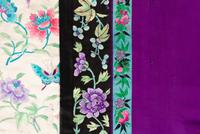 A Purple Ground Embroidered Silk Manchu Lady's Informal Robe