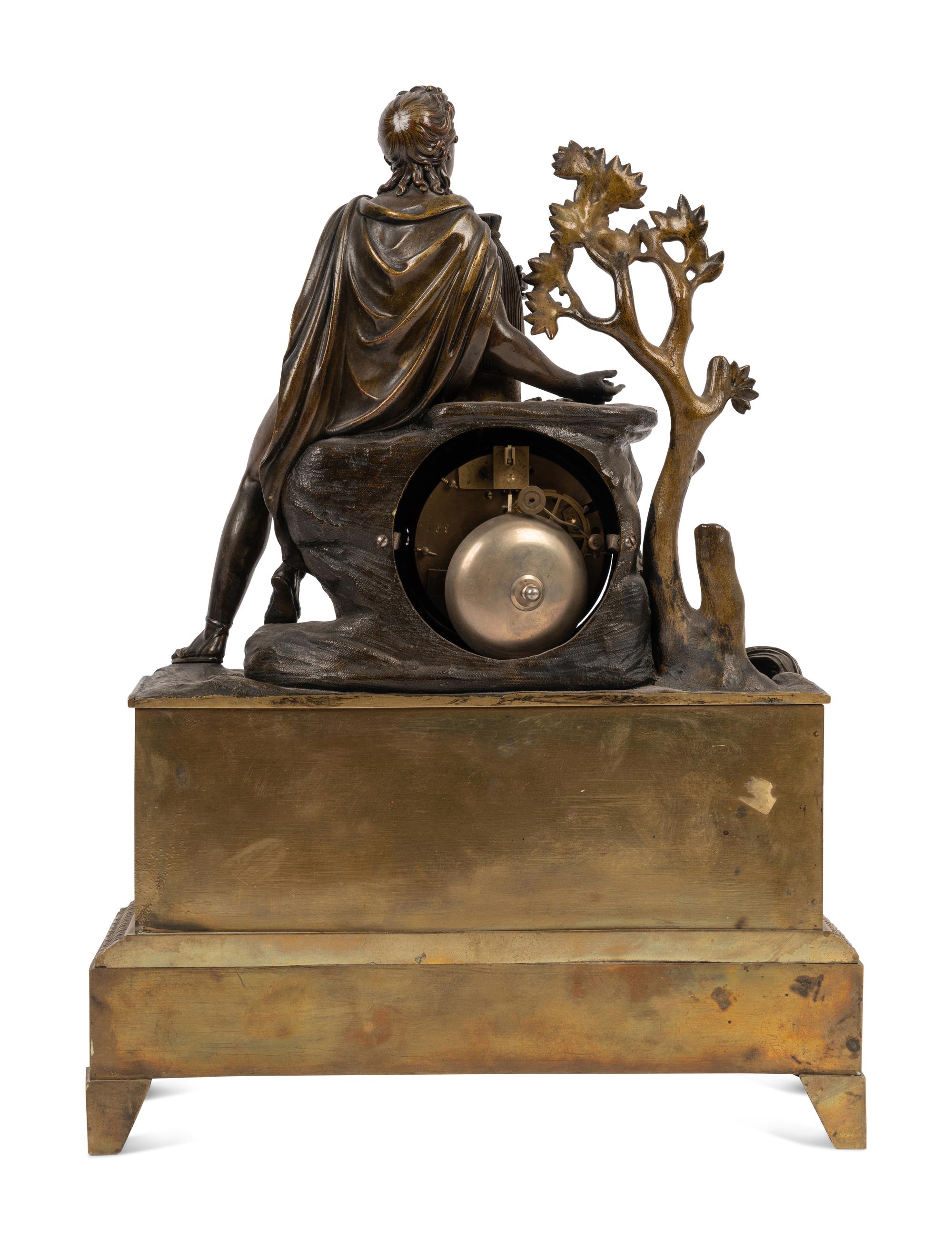 An Empire Style Gilt and Patinated Bronze Figural Mantel Clock