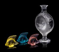A Lalique Perfume Bottle and Three Lalique Fish