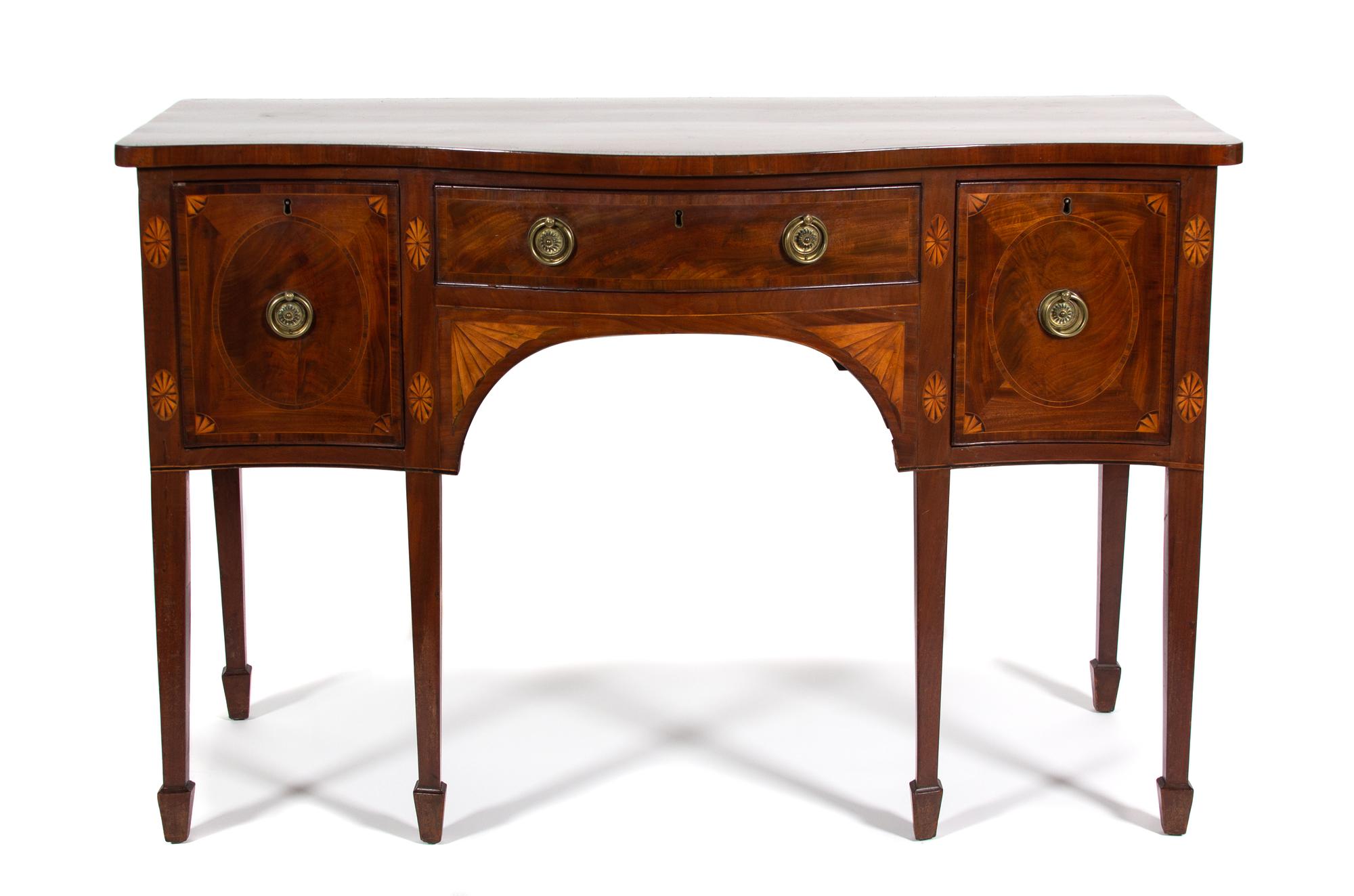 A Hepplewhite Serpentine Front Mahogany Sideboard Height 35 1/2 x width 54 1/8 x depth 24 1/4 inches. — CIRCA 1800