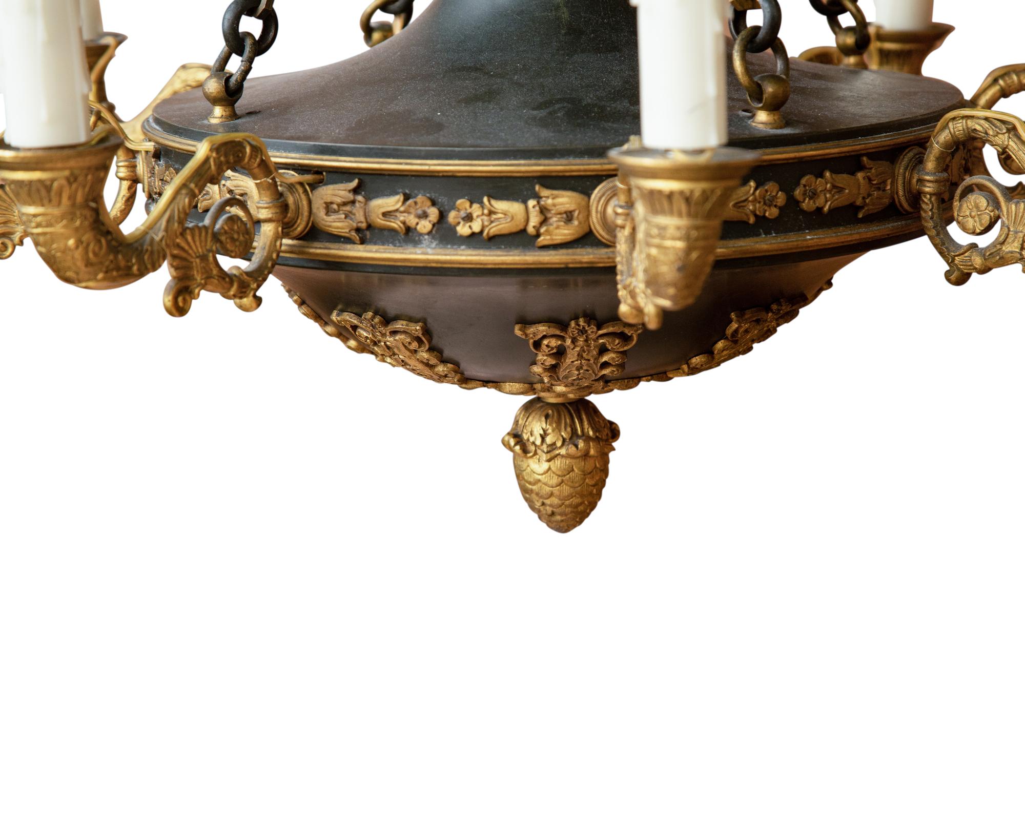 An Empire Style Patinated and Gilt Bronze Eight-Light Chandelier
