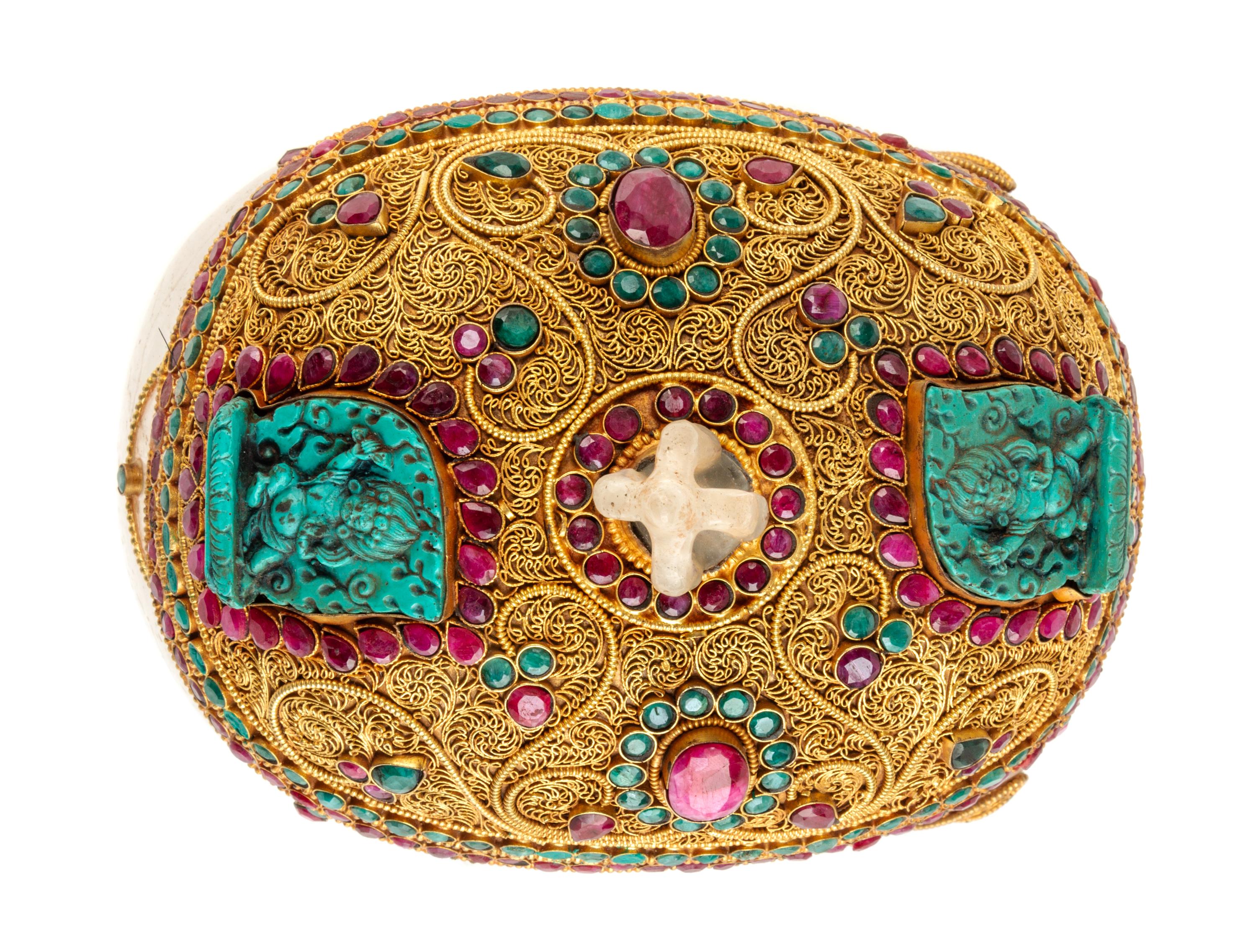 A Mughal Style Gilt Metal and Stone Inset Rock Crystal Skull Height 8 1/2 inches. — 20TH CENTURY