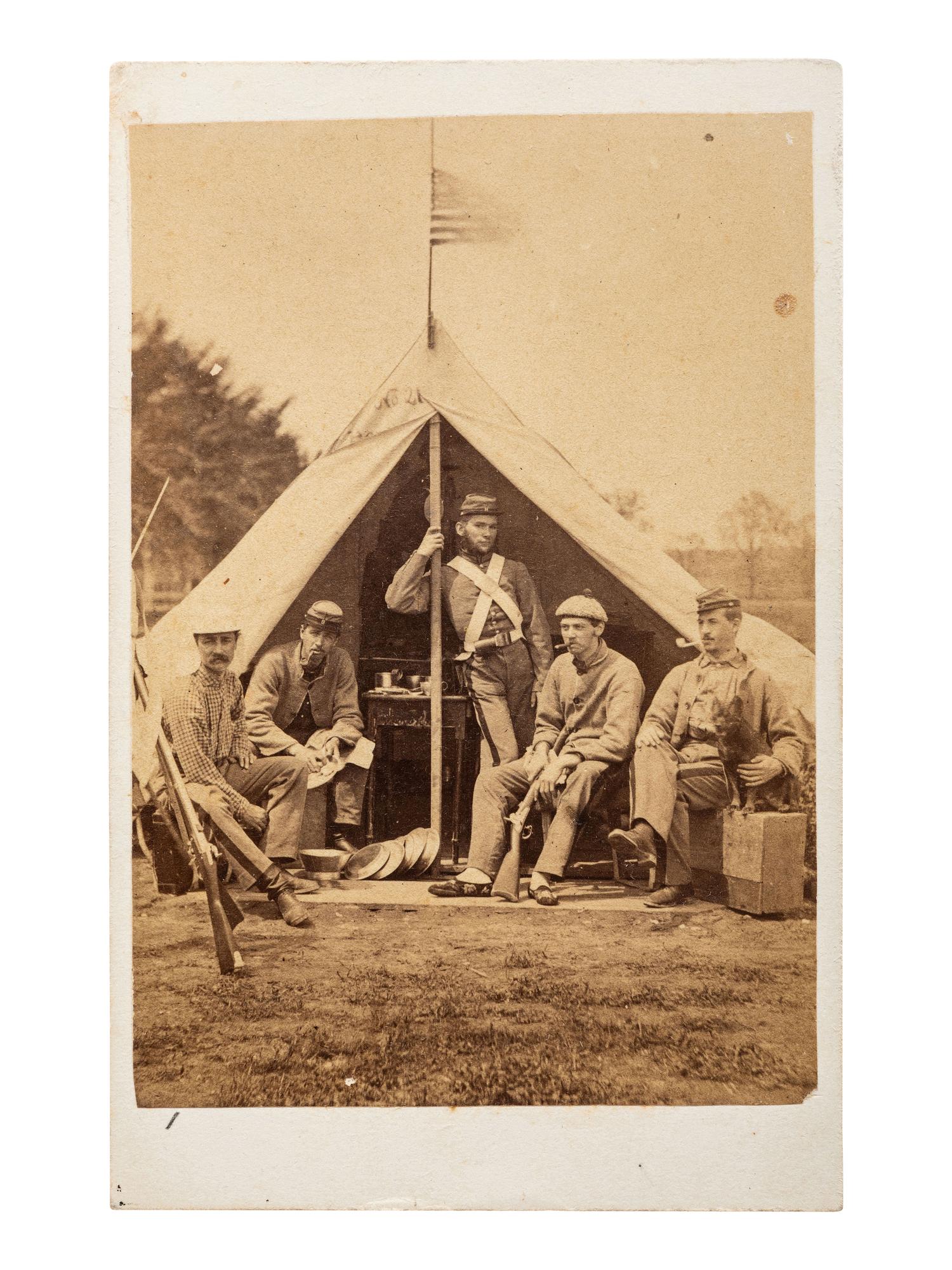 [CIVIL WAR]. A pair of CDVs featuring soldiers, likely members of the 7th NY state militia, posed just outside of a tent at "Camp Cameron, May 1861."