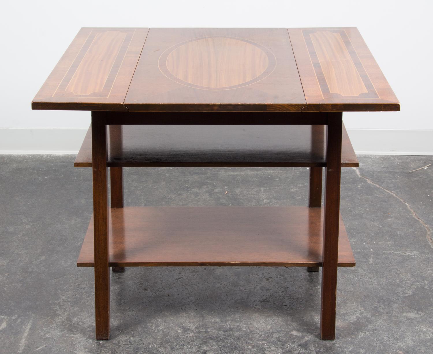 A Georgian Style Mahogany Drop-leaf Table Height 27 x width 16 x depth 27 1/2 inches (closed).