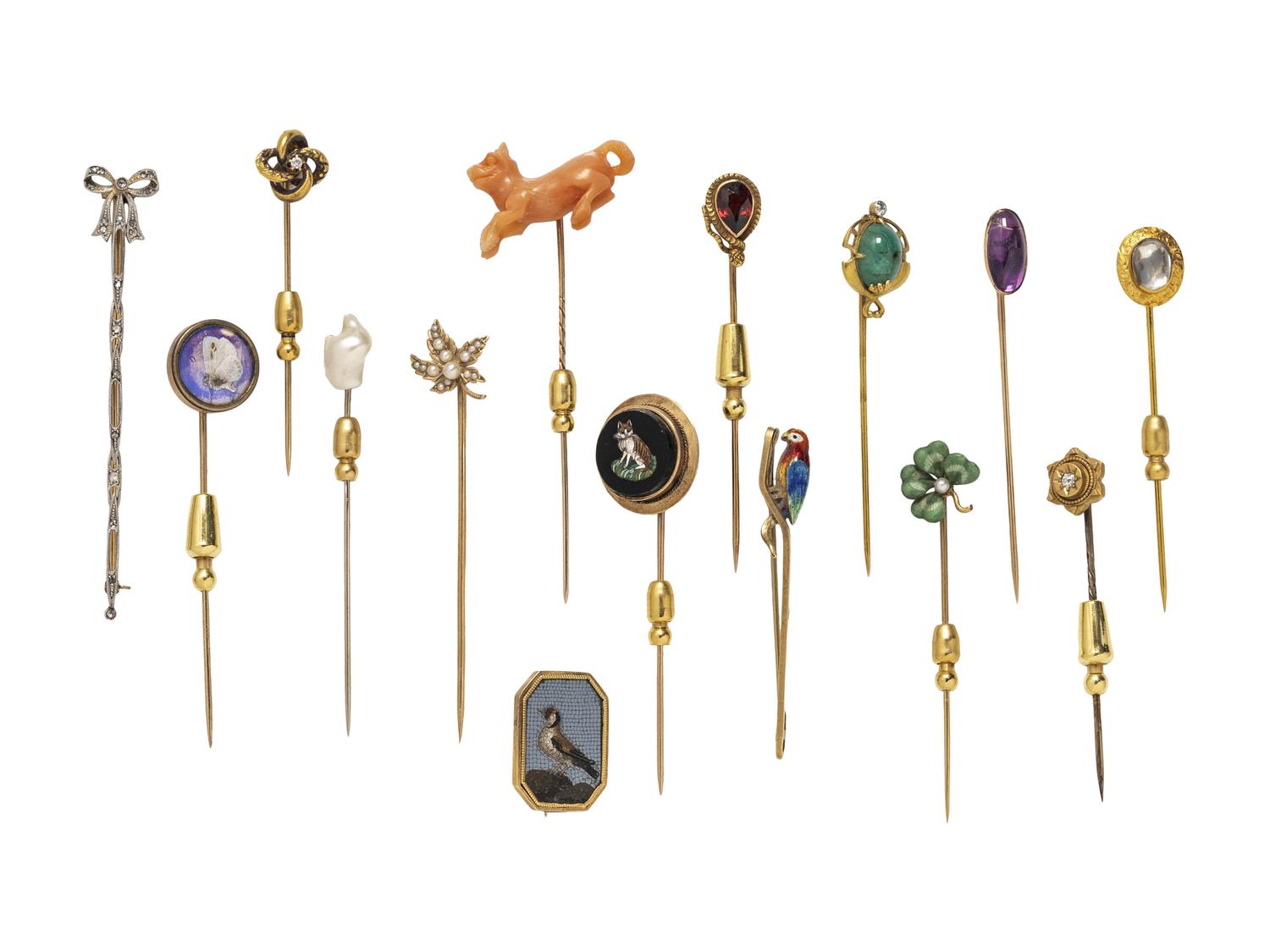 COLLECTION OF STICKPINS AND A BROOCH