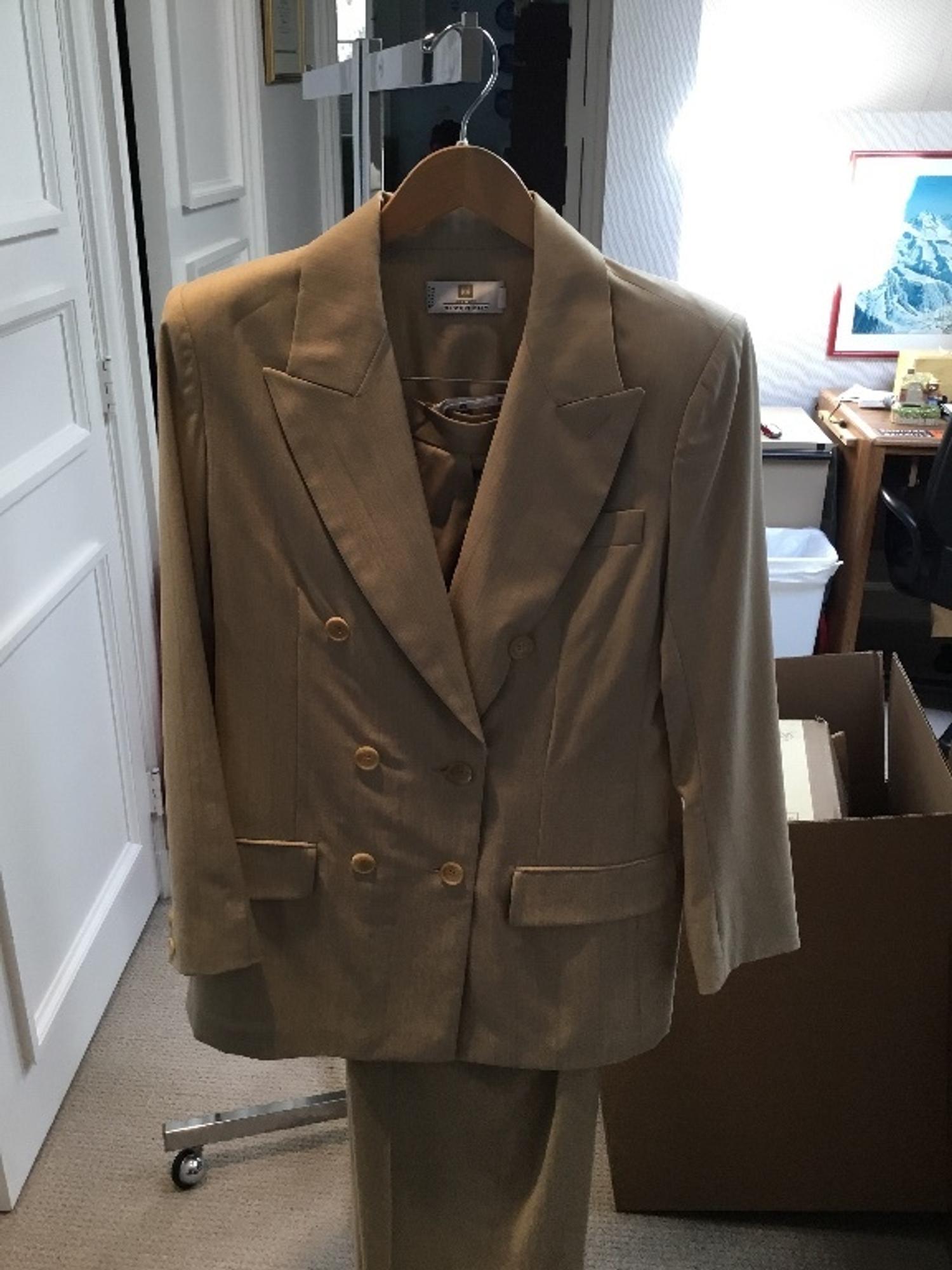 A Givenchy Tan Wool Pinstripe Pant Suit, Size 40.