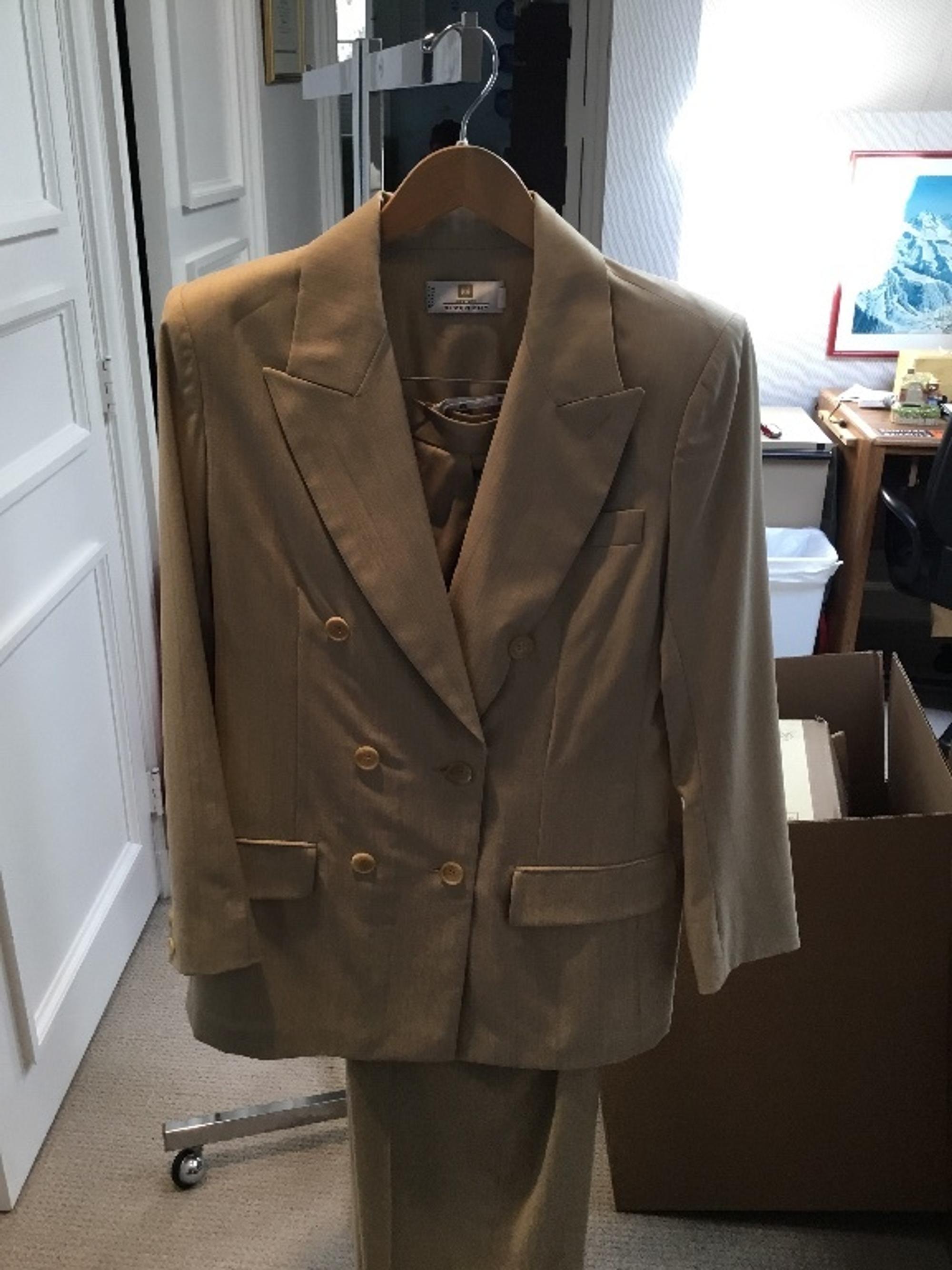 A Givenchy Tan Wool Pinstripe Pant Suit, Size 40.